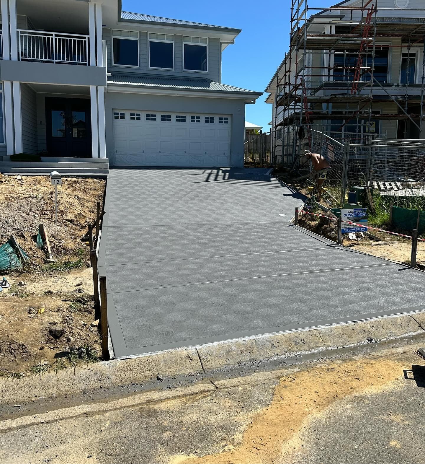 Coloured concrete driveway and entrance stairs at Catherine Hill Bay