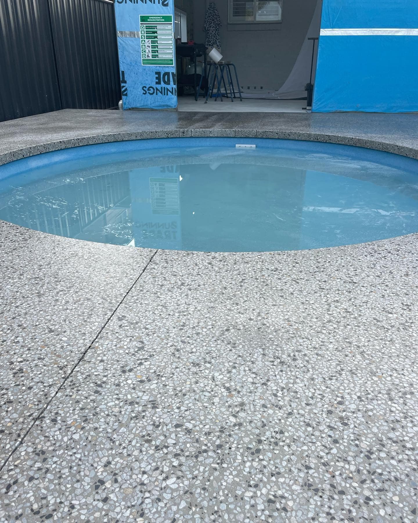Circle pool with a honed waterfall-edge surround
